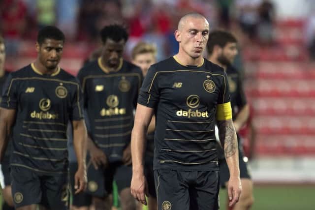 Celtic's Scott Brown trudges off following the defeat by Lincoln Red Imps. Picture: Craig Foy/SNS