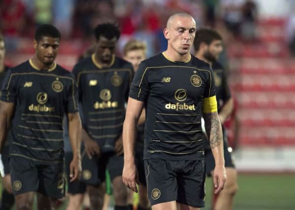 Celtic's Scott Brown trudges off following the defeat by Lincoln Red Imps. Picture: Craig Foy/SNS