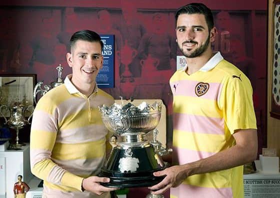 Alim Ozturk models the new Hearts away kit while Jamie Walker wears Bobby Walker's shirt