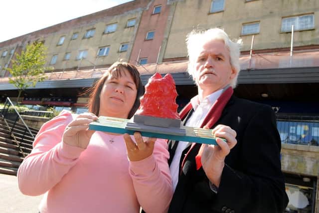 Denny residents and regeneration campaigners Sharon Tait and Brian McCabe accept the Plook on the Plinth award in 2010. Picture: Michael Gillen