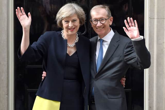 Theresa May and husband Philip John May enter 10 Downing Street yesterday.  (Photo by Karwai Tang/Getty Images)