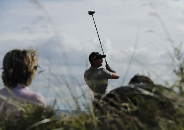 Jason Day plays his shot from the 13th tee during practice yesterday. Picture: Ben Curtis/AP