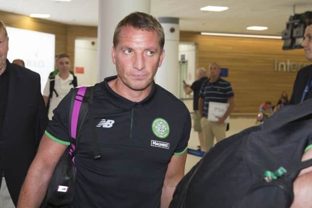 Celtic manager Brendan Rodgers arrives back at Glasgow Airport following the defeat by Lincoln Red Imps. Picture: Ross Brownlee/SNS