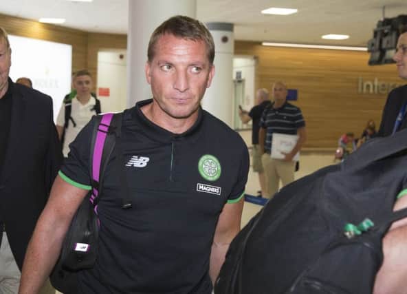 Celtic manager Brendan Rodgers arrives back at Glasgow Airport following the defeat by Lincoln Red Imps. Picture: Ross Brownlee/SNS