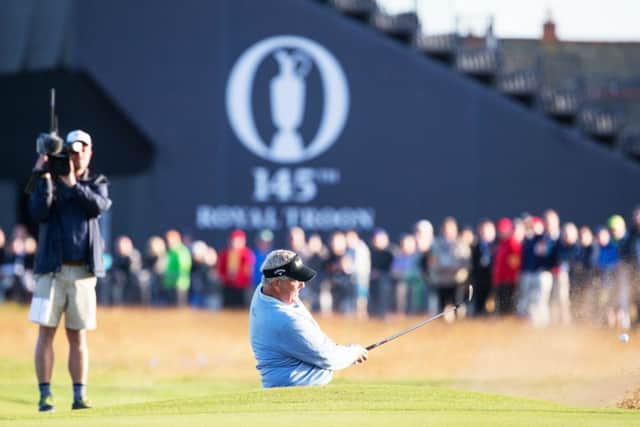 Colin Montgomerie plays out sideways from a bunker at the first at Royal Troon. Picture: SNS