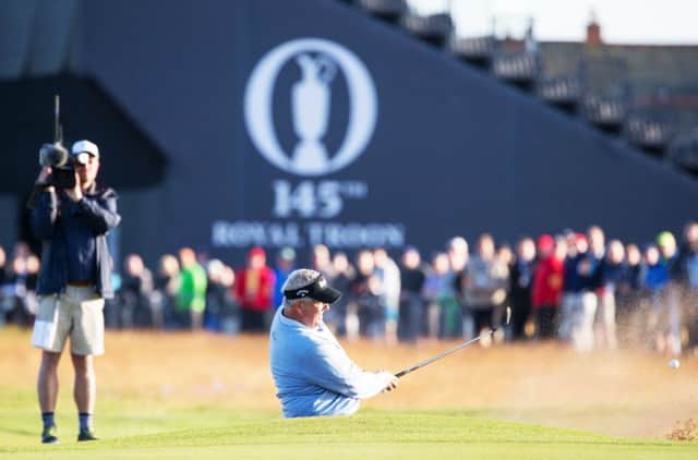Colin Montgomerie plays out sideways from a bunker at the first at Royal Troon. Picture: SNS