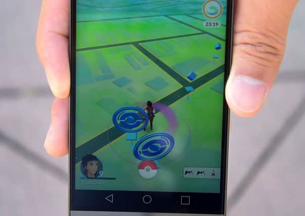 The game uses GPS data to help users locate Pokemon near them. Picture: AFP/Getty Images