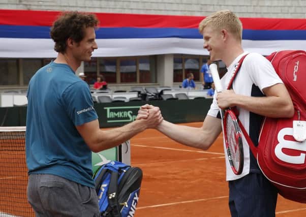 Andy Murray and Kyle Edmund shake hands before practice. Picture: Srdjan Stevanovic/Getty