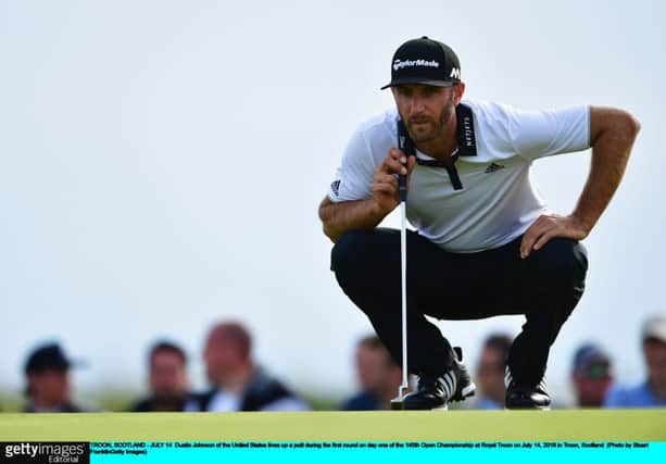 Dustin Johnson lines up a putt at Troon yesterday. The world No 2 signed for a level-par 71.  Picture: Stuart Franklin/Getty