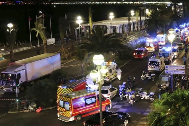 Emergency services vehicles work on the scene. Picture: AP
