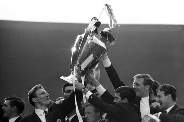 The delighted Celtic players show off the European Cup to their fans. Picture: SNS
