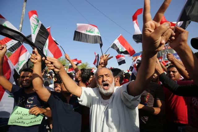 Protesters demanded reform to a background of patriotic music and flag-waving. Picture: AFP/Getty