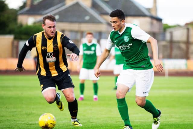 Alex Harris, right, went on loan to Dundee and Queen of the South. Photograph: Graham Stuart/SNS