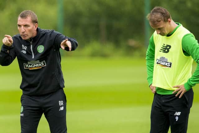 Celtic manager Brendan Rodgers, at training yesterday alongside striker Leigh Griffiths, has told his players to remain calm and learn from their defeat in Gibraltar. Picture: SNS