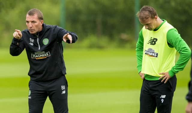Celtic manager Brendan Rodgers, at training yesterday alongside striker Leigh Griffiths, has told his players to remain calm and learn from their defeat in Gibraltar. Picture: SNS