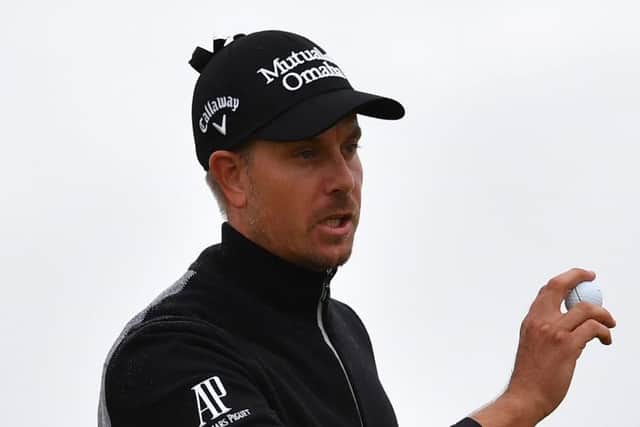 Henrik Stenson, pictured, and Soren Kjeldsen are well placed for the weekend after posting impressive scores in difficult weather conditions at Troon yesterday. Picture: AFP/Getty