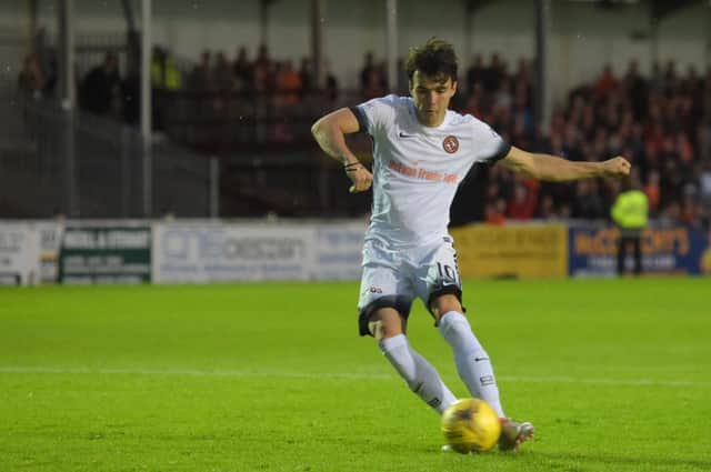 Scott Fraser scores from the penalty sport to earn an extra point for Dundee United in the Betfred League Cup at Gayfield. Picture: SNS