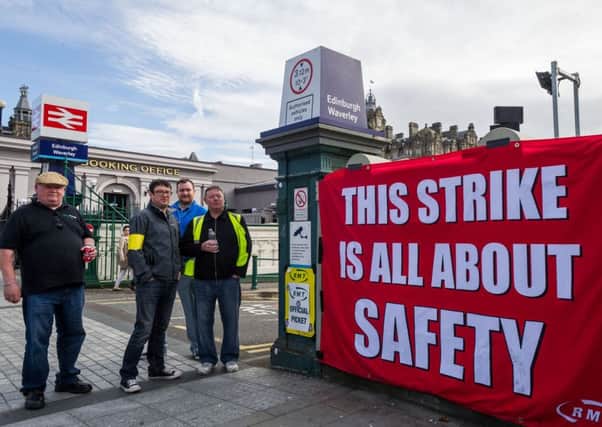 Striking staff at a ScotRail picket line at Waverley Station in Edinburgh yesterday. Picture: Steven Scott Taylor