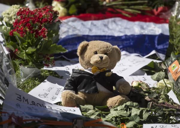 Five arrested following truck tragedy in Nice as memorials continue to be laid. Picture: AP Photo/Laurent Cipriani