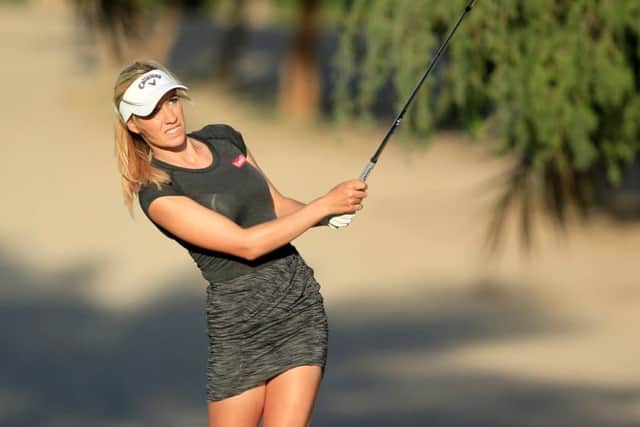 Paige Spiranac plays an approach shot in Dubai. Picture: David Cannon/Getty Images