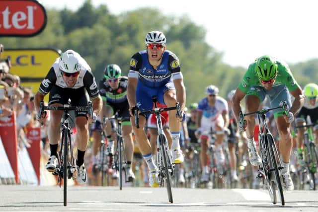 Mark Cavendish, left, leaves Marcel Kittel, centre, and Peter Sagan in his wake after attacking in the final 150 metres to win his fourth stage of this years Tour de France. Picture: Chris Graythen/Getty Images