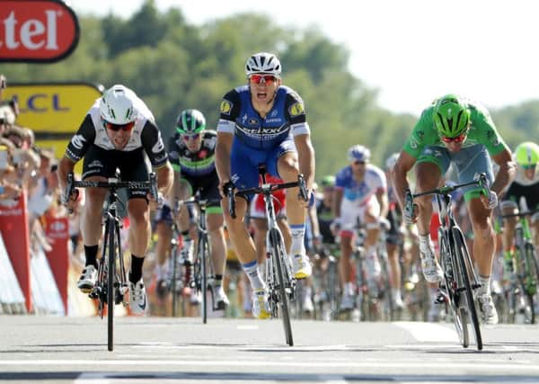 Mark Cavendish, left, leaves Marcel Kittel, centre, and Peter Sagan in his wake after attacking in the final 150 metres to win his fourth stage of this years Tour de France. Picture: Chris Graythen/Getty Images
