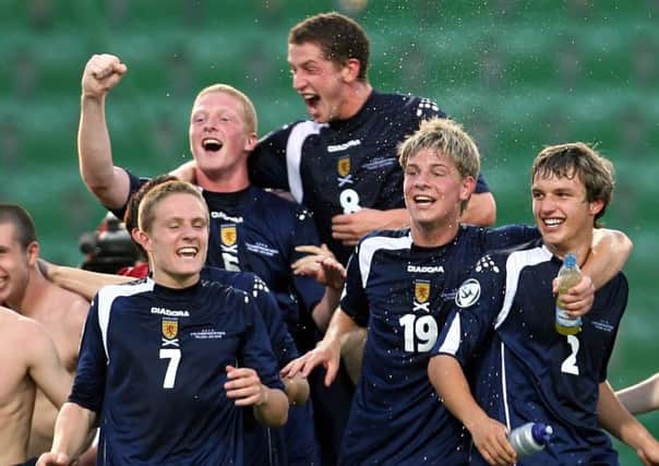 Calum Elliot (No.8) leads the celebrations as Scotland beat Czech Republic to reach the 2006 U19 Euro final. Picture: SNS