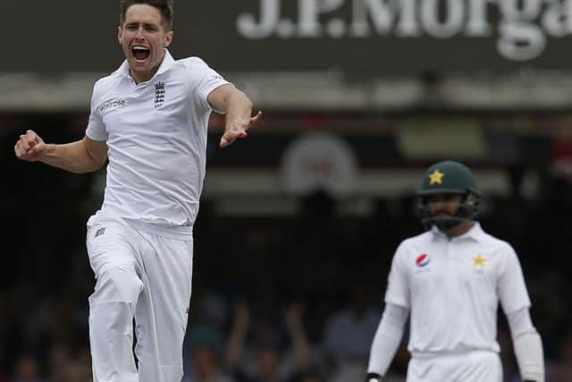 Englands Chris Woakes celebrates taking the wicket of Shan Masood (out of picture). Picture: Ian Kington/Getty