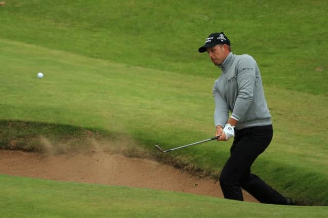 Henrik Stenson of Sweden plays from a bunker at the 16th which Mickelson birdied. Photograph: Mike Ehrmann/Getty