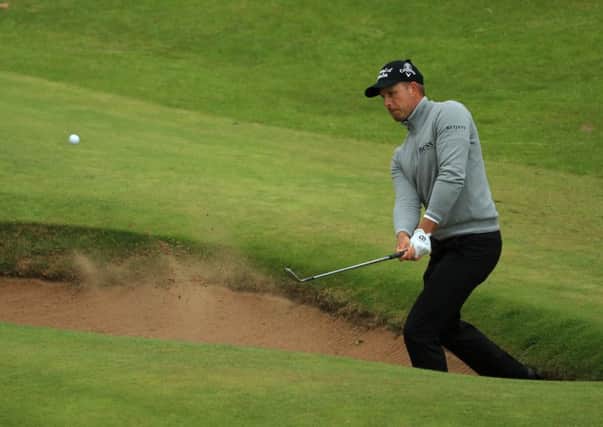 Henrik Stenson of Sweden plays from a bunker at the 16th which Mickelson birdied. Photograph: Mike Ehrmann/Getty