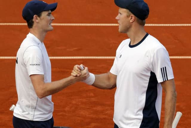 Britain's Jamie Murray and Dom Inglot celebrate their win over Serbia's Filip Krainovic and Nenad Zimonjic. Picture: Pedja Milosavljevic/AFP/Getty Images