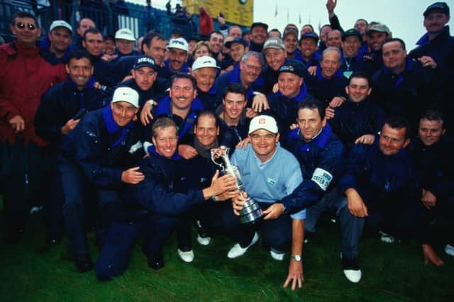 Paul Lawrie of Scotland poses with the trophy with the green staff after winning the British Open 1999. Picture: Getty