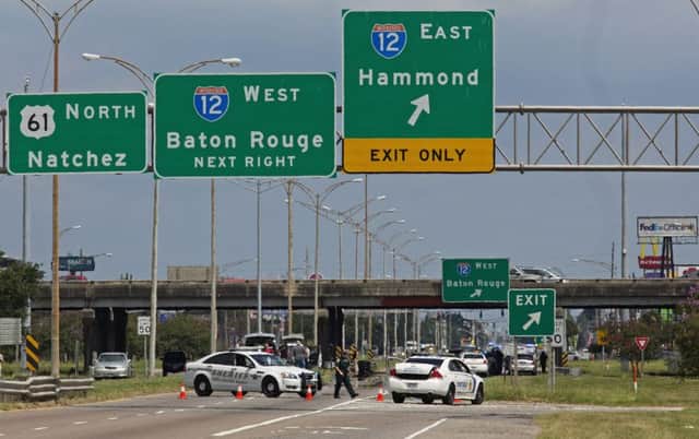 Baton Rouge police block Airline Highway in the city after fellow officers were shot in what has been described as an ambush. Picture: AP