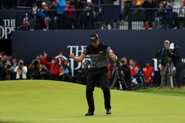 Henrik Stenson celebrates after sinking his final putt yesterday which gave him victory by three shots over Phil Mickelson. Picture: Getty