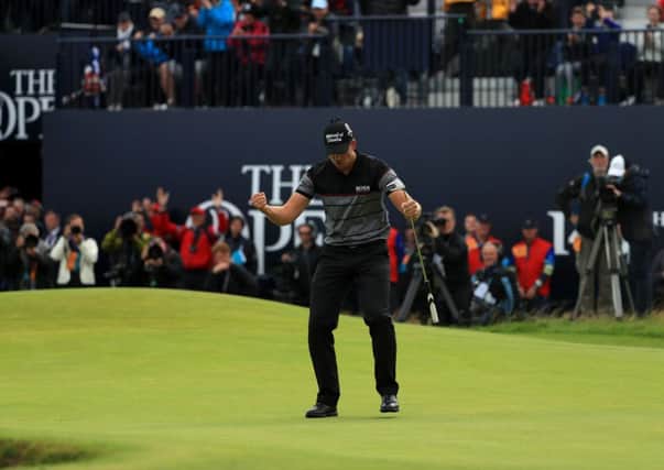 Henrik Stenson celebrates after sinking his final putt yesterday which gave him victory by three shots over Phil Mickelson. Picture: Getty