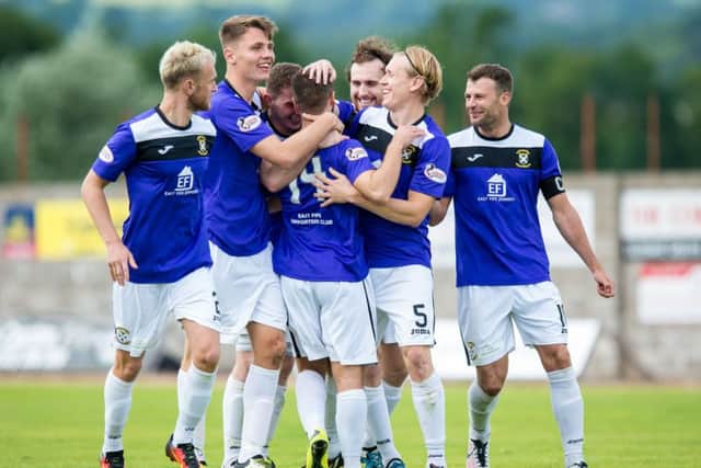 East Fife players celebrate after winning the shoot-out. Picture: SNS
