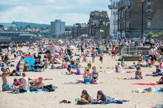 A crowded Portobello Beach in Edinburgh. Temperatures could reach 28 Celcius. Picture: Ian Georgeson.