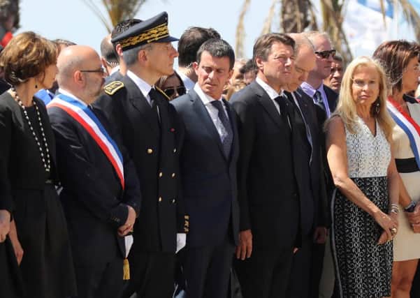 Manuel Valls, centre, is among mourners gathered to remember the victims of last week's Nice truck rampage that killed at least 84 people. Picture: AFP/Getty Images