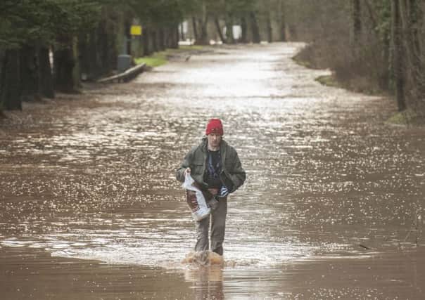A man wades through floodwater in Jedburgh. Picture: Phil Wilkinson