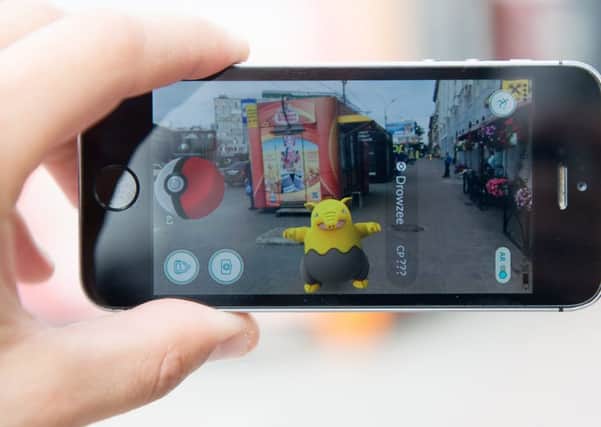 The Pokemon Go craze is sweeping the country. The location-based mobile game runs on a smartphone. The application, developed by Niantic, allows players to catch and train Pokemons using a phone's GPS and camera. Picture: Kirill Kukhmar\TASS via Getty Images