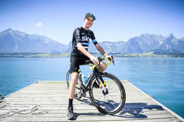 Tour de France leader Chris Froome poses for photographs on the shore of Lake Thun. Picture: Manuel Lopez/Keystone via AP