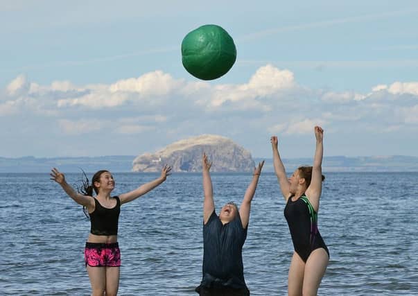 Kianna McGloughlan, Lewis Bell and Poppy Savage enjoy the sea at Belhaven beach, Dunbar. Picture: Jon Savage