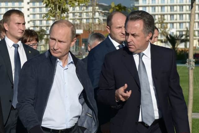 Russian president Vladimir Putin, second left, pictured with sports minister Vitaly Mutko, right, in Sochi. Picture: AP
