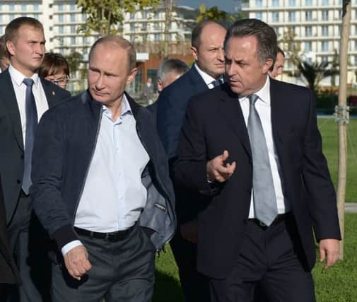 Russian president Vladimir Putin, second left, pictured with sports minister Vitaly Mutko, right, in Sochi. Picture: AP
