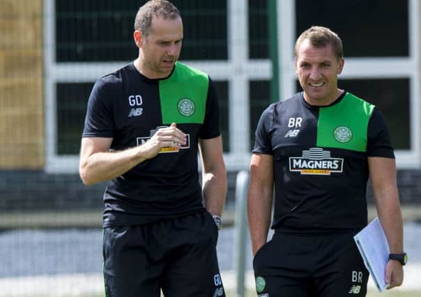 Celtic manager Brendan Rodgers, right, is concerned over his defensive options. Picture: SNS.