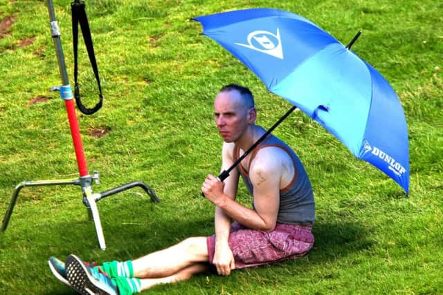 Ewen Bremner as Spud takes cover from the sun during filming on Arthurs Seat in Edinburgh. Picture: Hemedia