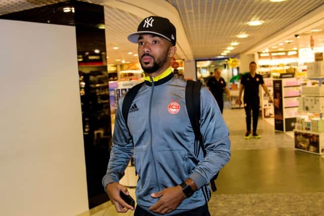 The squad, including right back Shay Logan, have been delayed at Aberdeen airport. Picture: SNS