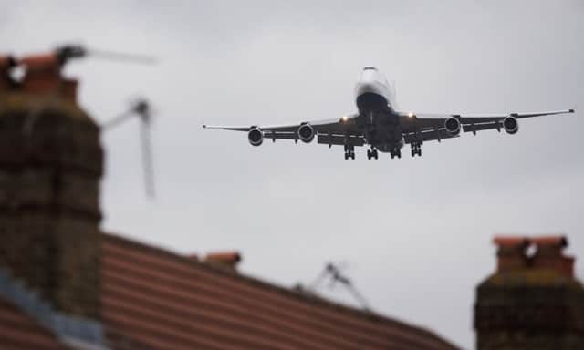 An aircraft flies over residential houses in Hounslow as it prepares to land at Heathrow. Picture: Getty Images