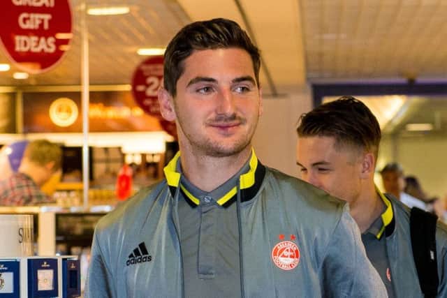 Kenny McLean at Aberdeen airport en route to Latvia where the Dons face Ventspils in today's second leg. Picture: SNS Group