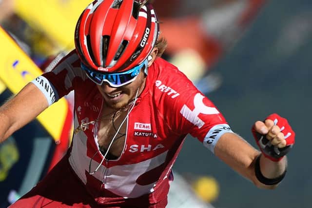 Russia's Ilnur Zakarin celebrates as he crosses the finish line to win stage 17 of the Tour de France. Picture: AFP/Getty Images
